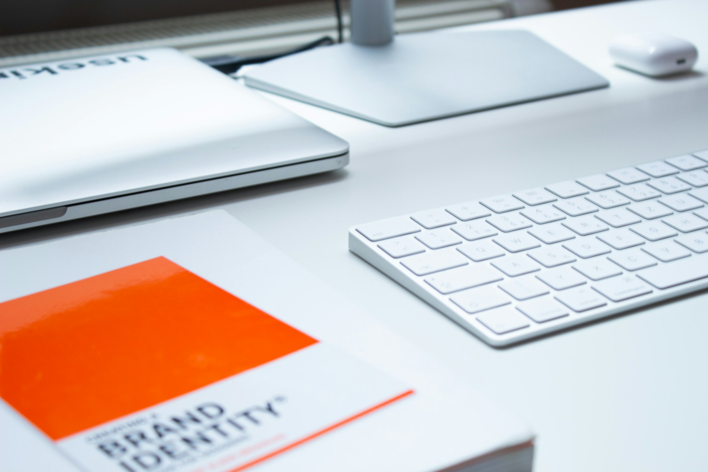 A book about brand identity in an office workspace. 